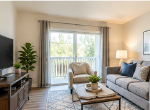 View of a 1st floor living room with couches and a colorful painting on the wall.